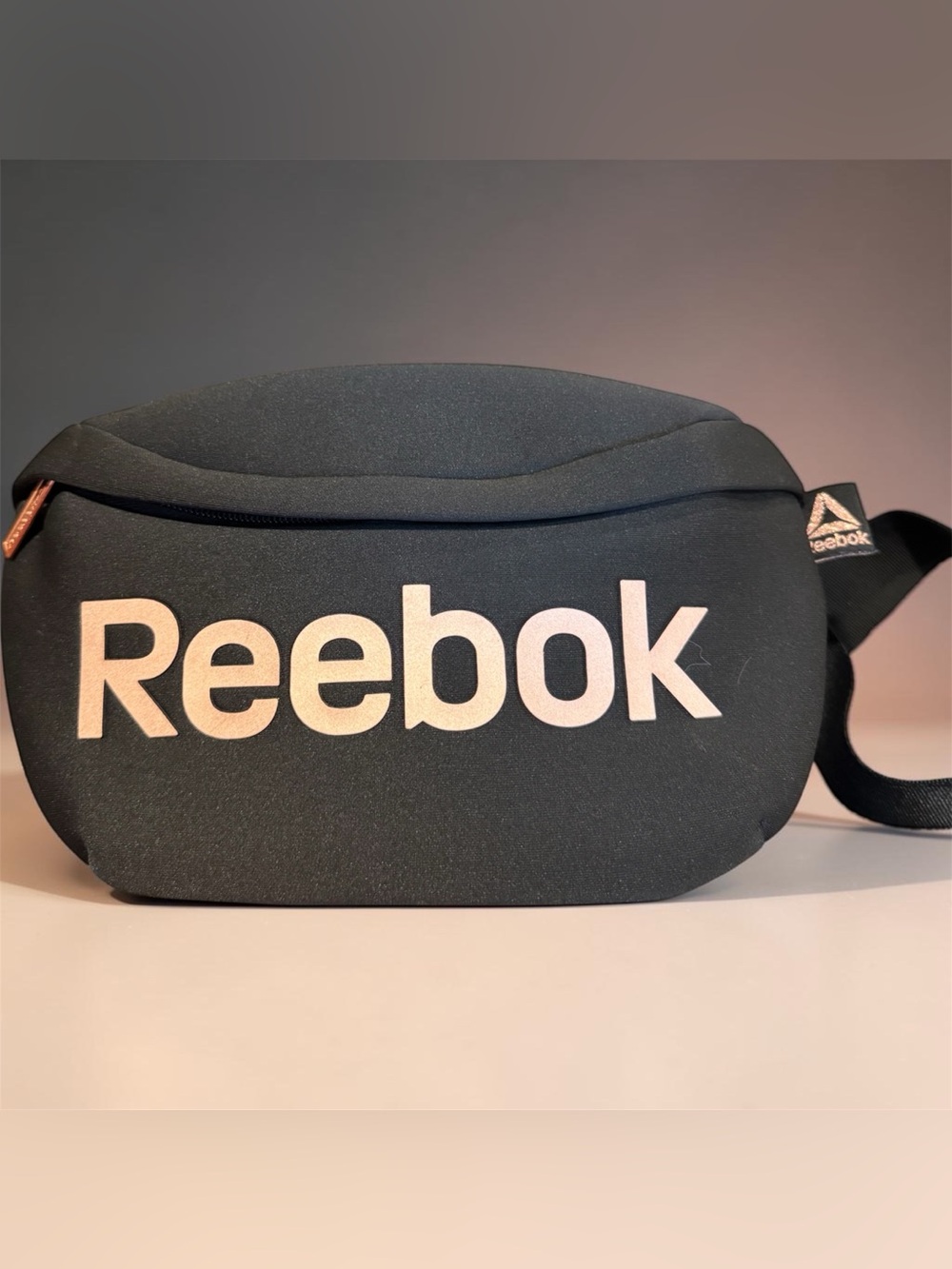 Black Reebok Verona Fanny Pack featuring a prominent Rose Color Logo